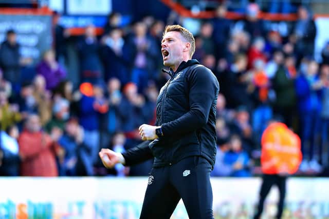 Hatters boss Rob Edwards celebrates a victory at Kenilworth Road