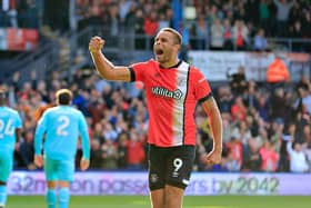 Carlton Morris celebrates scoring from the penalty spot against Wolves - pic: Liam Smith