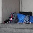 A homeless person sleeping rough in a doorway in Farringdon, London. Picture: Yui Mok/PA Wire