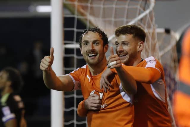 Danny Hylton celebrates scoring one of his 62 goals for the Hatters