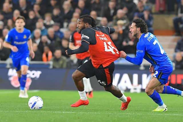 Kasey Palmer has his shirt pulled by Doncaster defender Jamie Sterry - pic: Andy Fitzsimons