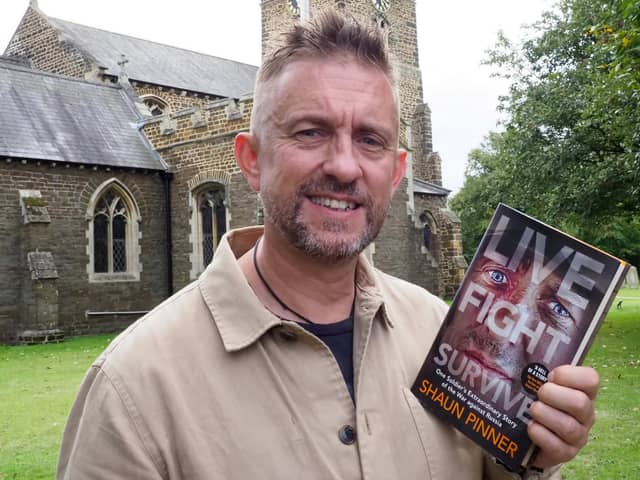 Shaun Pinner with his book: Live Fight Survive. Picture: Tony Margiocchi