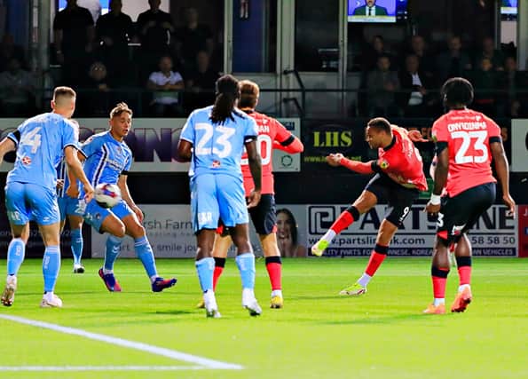 Carlton Morris hammers home the opener for Luton this evening