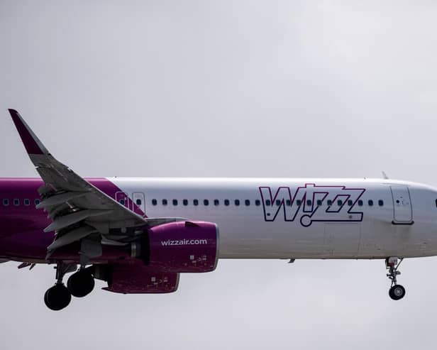 A Wizz Air jet comes in to land (Photo by BEN STANSALL/AFP via Getty Images)