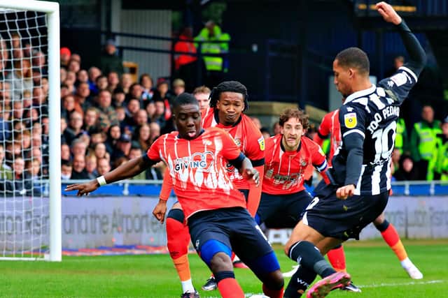 Town midfielder Marvelous Nakamba makes another tackle against Watford on Saturday