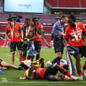 Town defender Amari'i Bell celebrates Luton's victory at Wembley