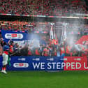 Hatters' players lift the trophy at Wembley Stadium