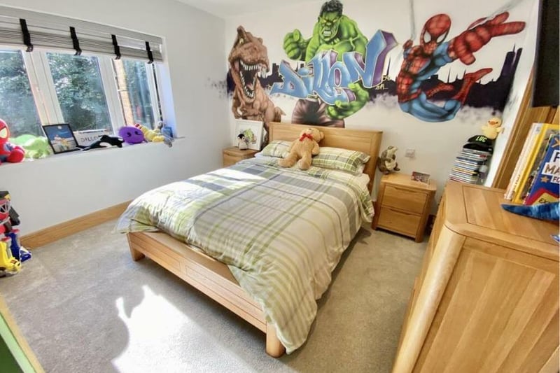 A kids bedroom, perfect for comic-book lovers