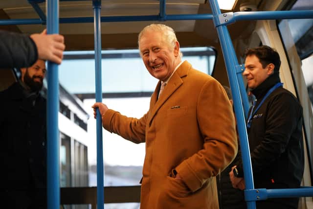 King Charles III travels in a DART carriage, to the Luton DART central terminal, during a visit to Luton on December 6. (Photo by YUI MOK/POOL/AFP via Getty Images)