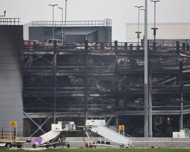 A charred section of a parking structure is seen after it caught fire and partially collapsed at London's Luton Airport on October 11, 2023.(Photo by HENRY NICHOLLS/AFP via Getty Images)