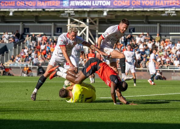 Hakeem Odoffin takes a tumble during Luton's 1-1 draw with Leyton Orient - pic: Duncan Jack / PRiME Media Images