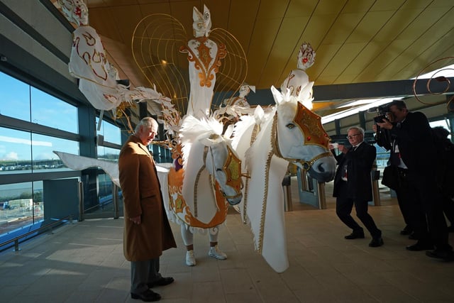 King Charles III meets a performer from the UK Centre For Carnival Arts during a visit to Luton DART Parkway Station PIC: Yui Mok/PA Wire