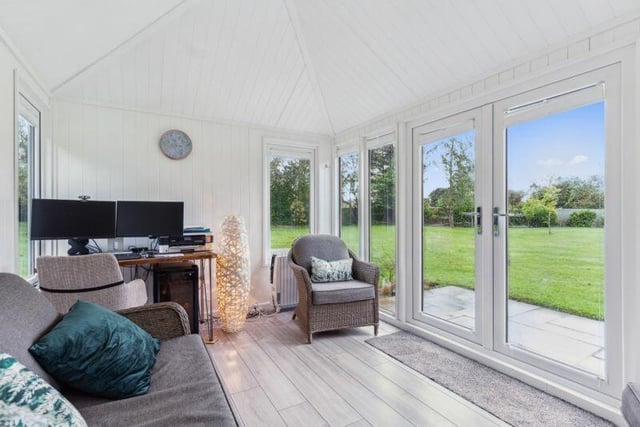 A bright detached summerhouse/studio - with plenty of natural light.