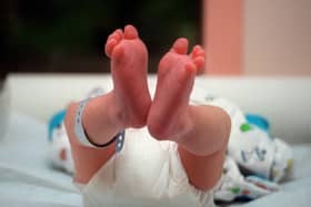 File photo of a baby in a maternity ward. (Photo by DIDIER PALLAGES/AFP via Getty Images)