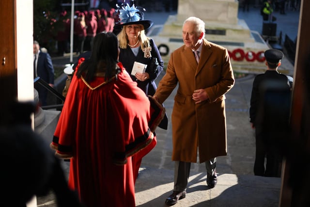 Britain's King Charles III (R) arrives at Luton Town Hall  (Photo by DANIEL LEAL/POOL/AFP via Getty Images)
