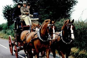 George Mossman at the reins of one of his carriages