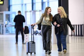Mothers and their adult children pictured travelling through London Luton Airport