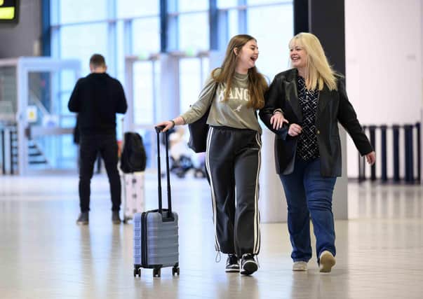 Mothers and their adult children pictured travelling through London Luton Airport