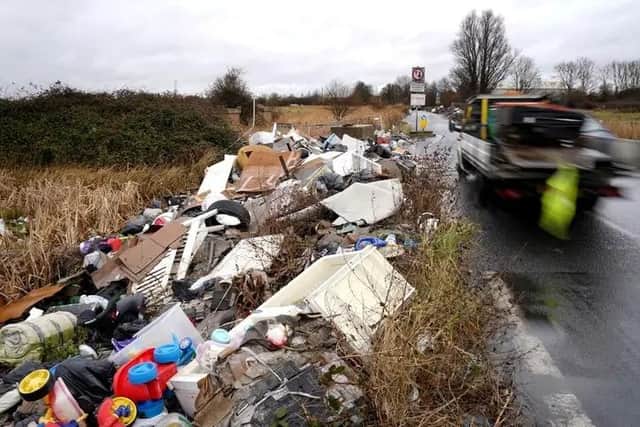 Fly tipped rubbish by side of a road. Picture: Gareth Fuller via PA Images