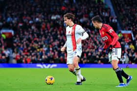 Tom Lockyer looks to find a team-mate during Luton's 1-0 defeat at Manchester United recently - pic: Liam Smith