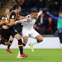 Town striker Carlton Morris is manhandled in the box by Hull defender Jacob Greaves on Friday night
