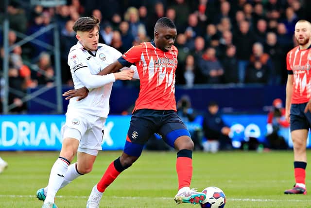 Marvelous Nakamba shields the ball under pressure against Swansea