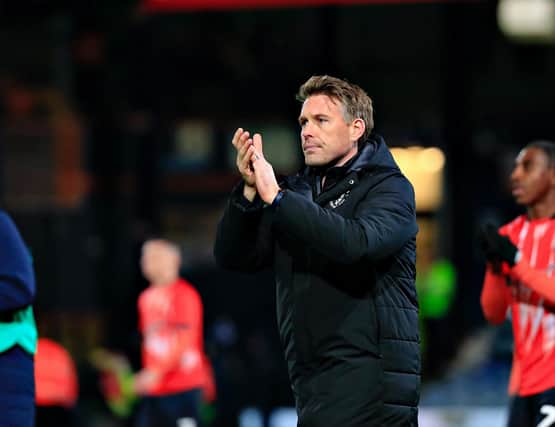 Town boss Rob Edwards applauds the Hatters fans