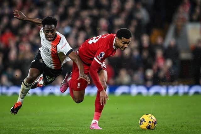 Sambi Lokonga fights for the ball with Liverpool's Dutch striker Cody Gakpo - pic: PAUL ELLIS/AFP via Getty Images