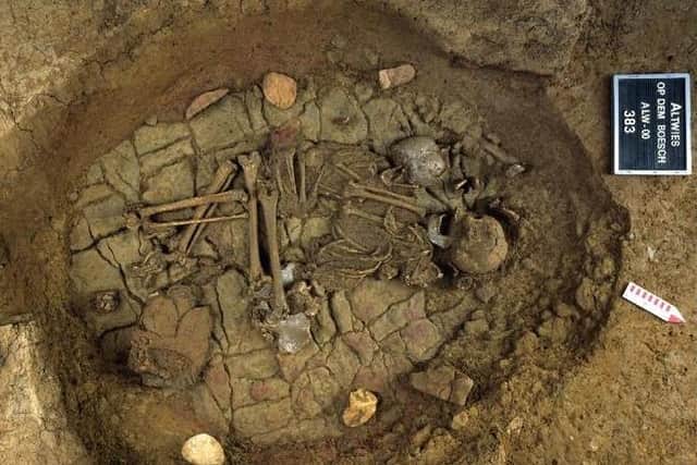 Skeletal remains of an adult and a child at Altwies ""Op dem Boesch"". A similar grave was found at Dunstable Downs. Picture:  Foni Le Brun-Ricalens, Institut National de Recherches Archéologiques, Luxemburg / SWNS