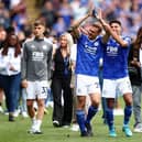 Kiernan Dewsbury-Hall applauds the Leicester crowd with former Luton defender James Justin