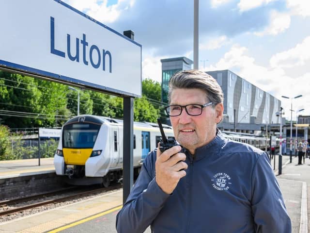 Mick preparing his announcements at Luton train station