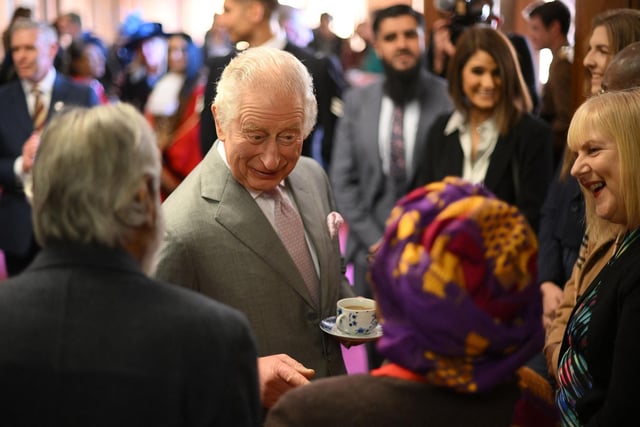 Britain's King Charles talks to guests (Photo by DANIEL LEAL/POOL/AFP via Getty Images)