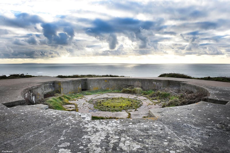A hand dug, gun emplacement looking out to sea.