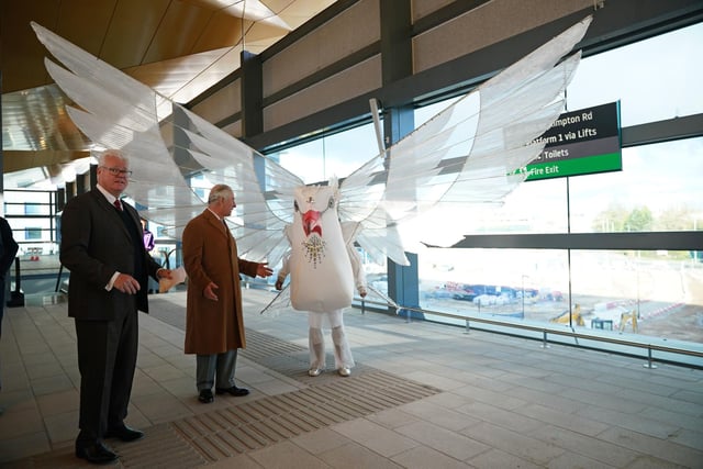 King Charles III meets a performer from the UK Centre For Carnival Arts during a visit to Luton DART Parkway Station to learn about the new cable-drawn mass passenger transit system  PIC: Yui Mok/PA Wire