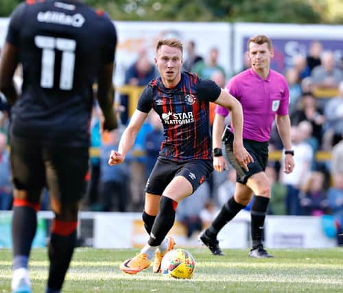 Cauley Woodrow has made his return to Kenilworth Road this summer