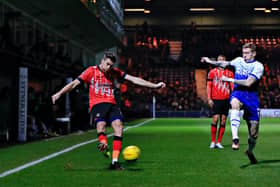 Reece Burke sends over a cross during Luton's 1-1 draw with Wigan in the FA Cup