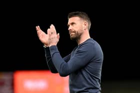 Hatters boss Rob Edwards applauds the Luton faithful after this evening's 2-1 defeat to Manchester United - pic: Shaun Botterill/Getty Images
