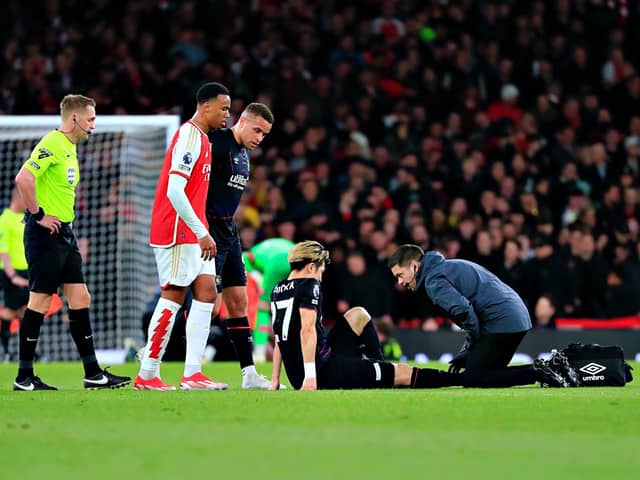 Daiki Hashioka receives treatment during Wednesday night's 2-0 defeat to Arsenal - pic: Liam Smith