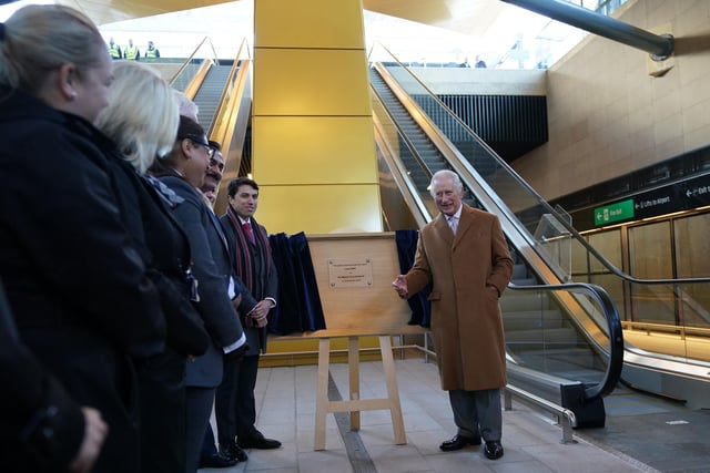 King Charles III unveils a plaque during a visit to Luton Airport  PIC: Yui Mok/PA Wire