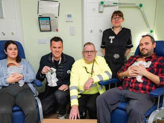 Tesco & Salvation Army representatives donate clothes to neonatal unit