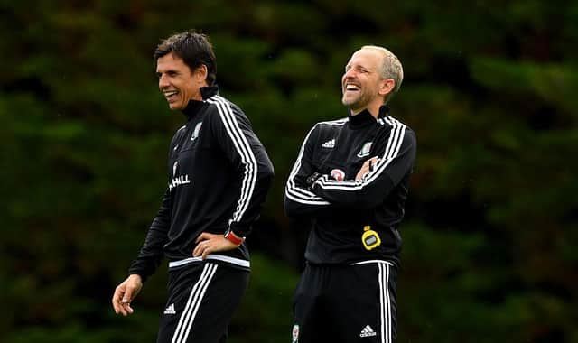 New Luton assistant Paul Trollope shares a joke with former Wales manager Chris Coleman during his time with the national side