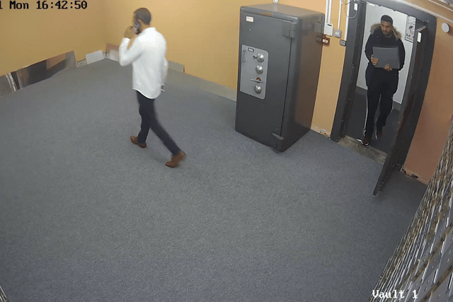 CCTV still of Waqas Hanif depositing box of cash into deposit centre