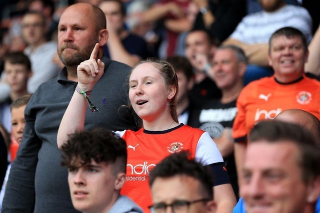 A Luton Town fan cheers their team during the Sky Bet Championship match between Luton Town and Huddersfield Town at Kenilworth Road on August 31, 2019.