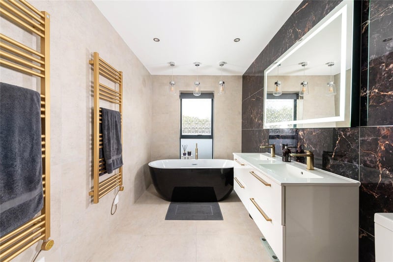 The property has four bathrooms - consisting of one family bathroom and three en-suites