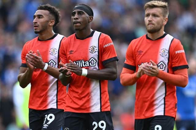 Luton's players applaud the travelling fans after a 4-1 defeat at Brighton on Saturday - pic: JUSTIN TALLIS/AFP via Getty Images