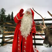 Santa Claus with his reindeer in Rovaniemi, on the Arctic circle of Lapland. (Picture: Martti Kainulainen/AFP via Getty Images)