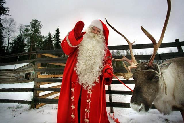 Santa Claus with his reindeer in Rovaniemi, on the Arctic circle of Lapland. (Picture: Martti Kainulainen/AFP via Getty Images)