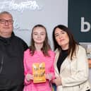 Teri-Rose pictured with her parents at the book launch
