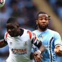 Town midfielder Marvelous Nakamba wins a header against Coventry