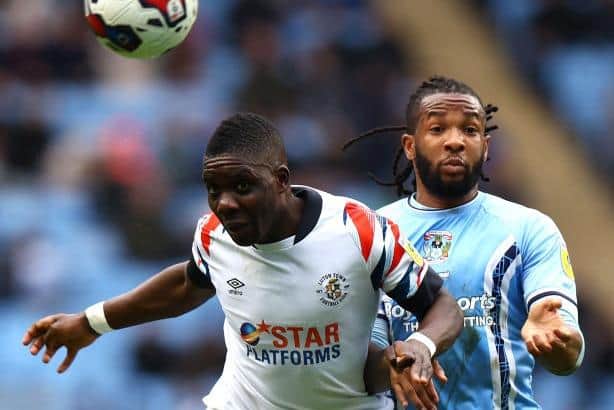 Town midfielder Marvelous Nakamba wins a header against Coventry
